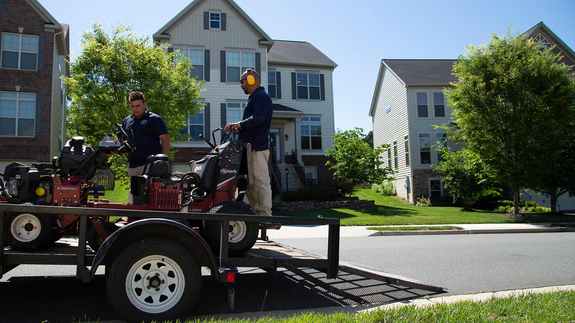 Two lawn professionals prepping to take care of a customer's lawn near Arlington, VA.