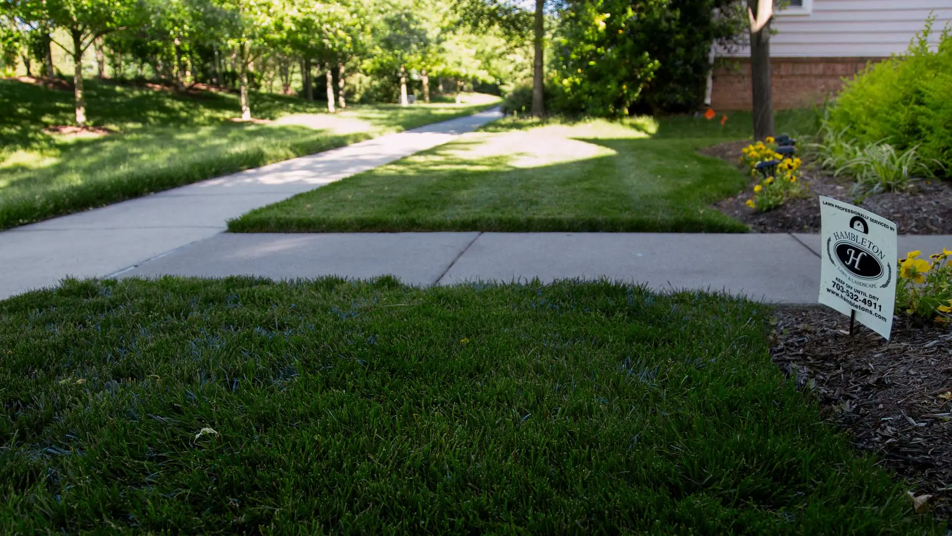 Signage in a lawn after being serviced in Potomac Falls, VA.