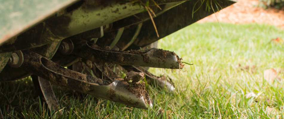 Close up on an aeration machine in action on a property in Ashburn, VA.