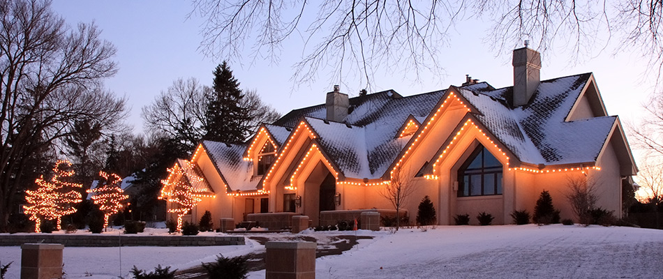 A beautiful home in Fairfax, Virginia with great holiday lighting along the roofing and landscaping.