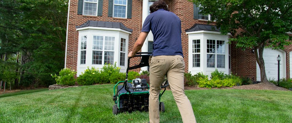 Our landscape maintenance professional mowing our client's lawn in Sterling, VA.