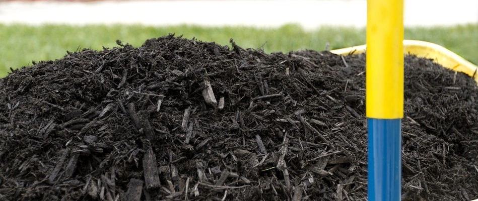 A pile of fresh mulch ready to be installed on a property in Fairfax, VA.