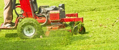 Our lawn maintenance professional mowing a lawn in Winchester, VA.